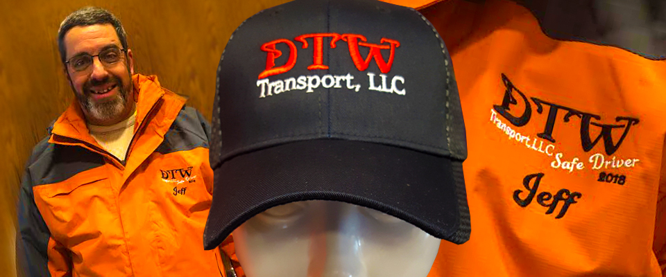 DTW Transport embroidered cap and personalized orange work jacket from the Premier Graphics portfolio.